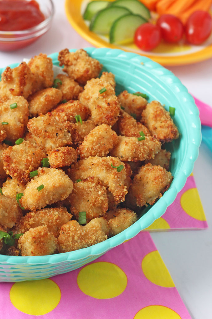 Delicious Popcorn Chicken made with Rice Krispies on a pink and yellow napkin