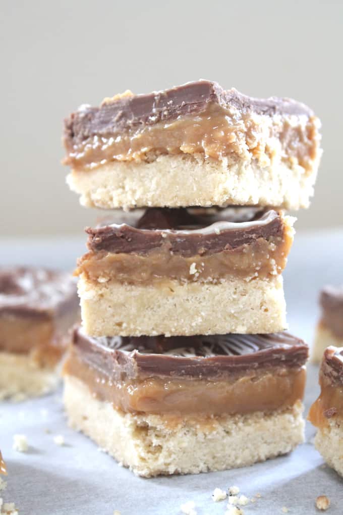 a close up of the millionaire shortbread stack showing the layers of biscuit, caramel and chocolate.