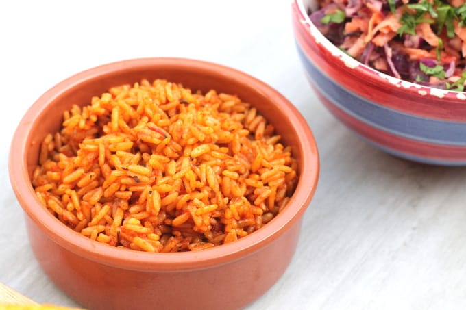 spicy rice in a brown ceramic serving bowl