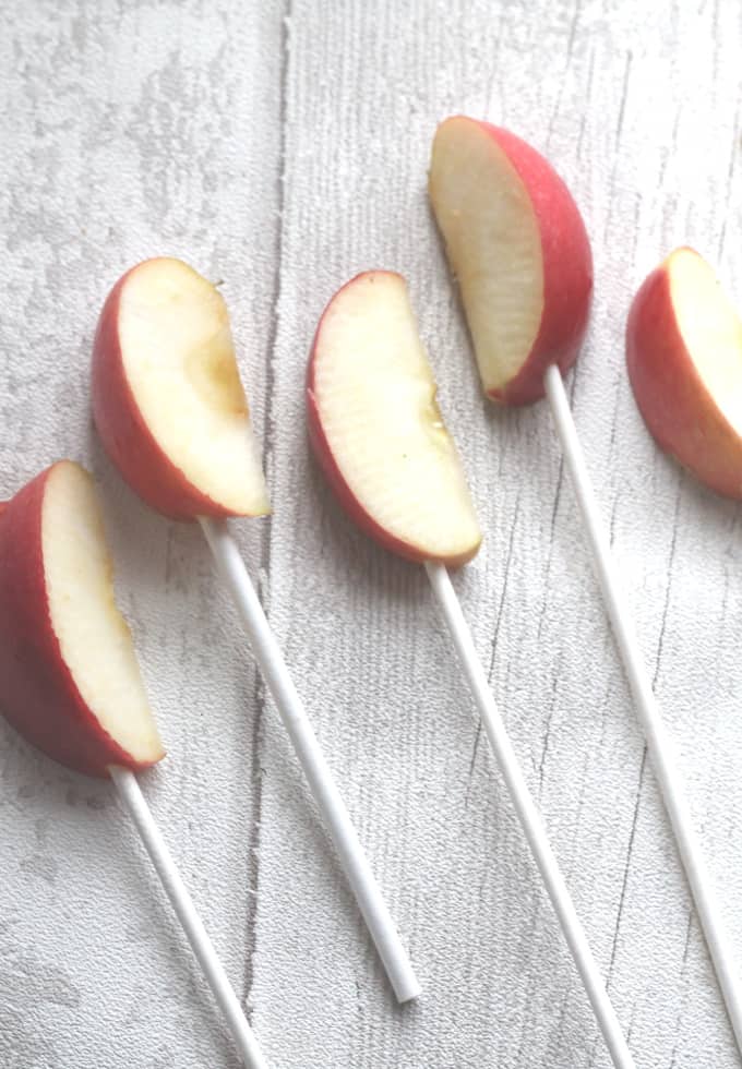 apple wedges on a cake pop stick