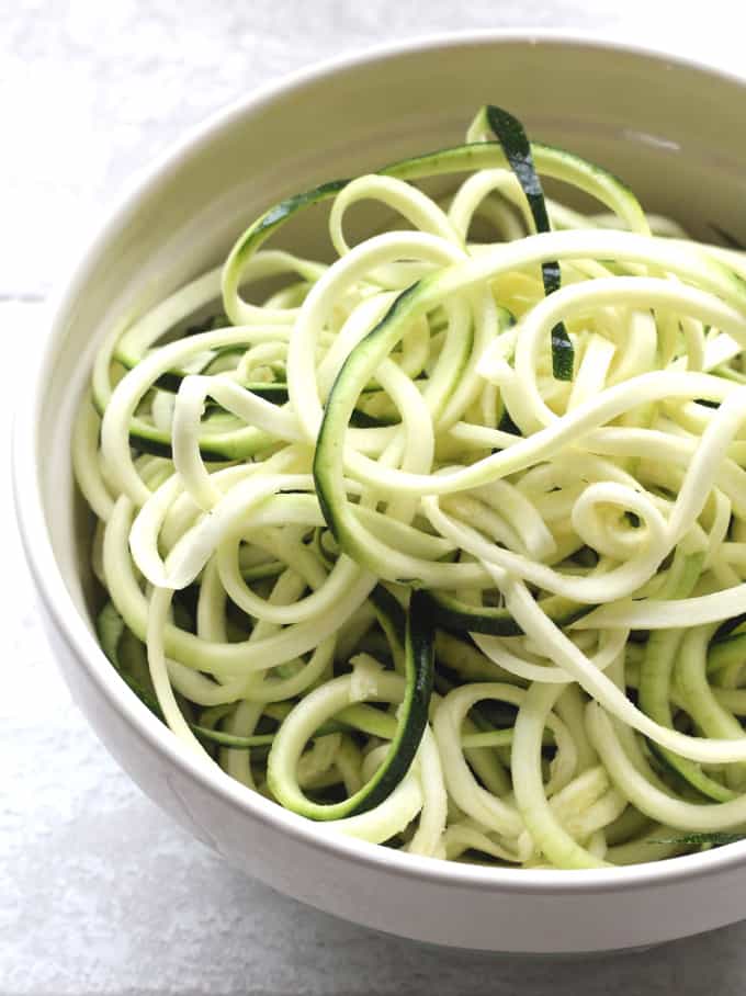 spiralized courgette in a white bowl