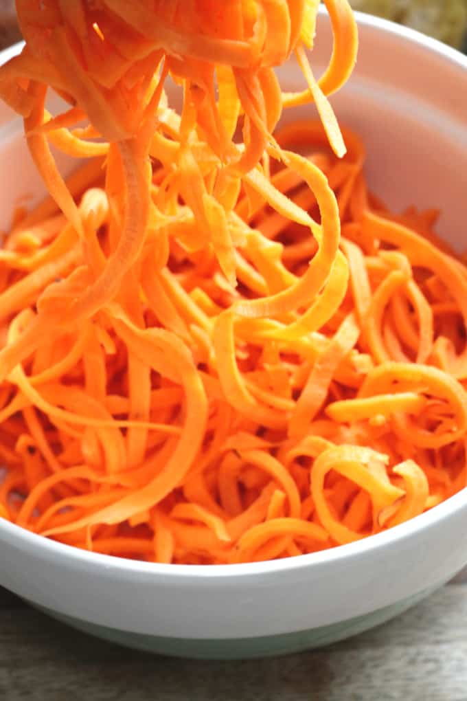 spiralized sweet potato in a white bowl