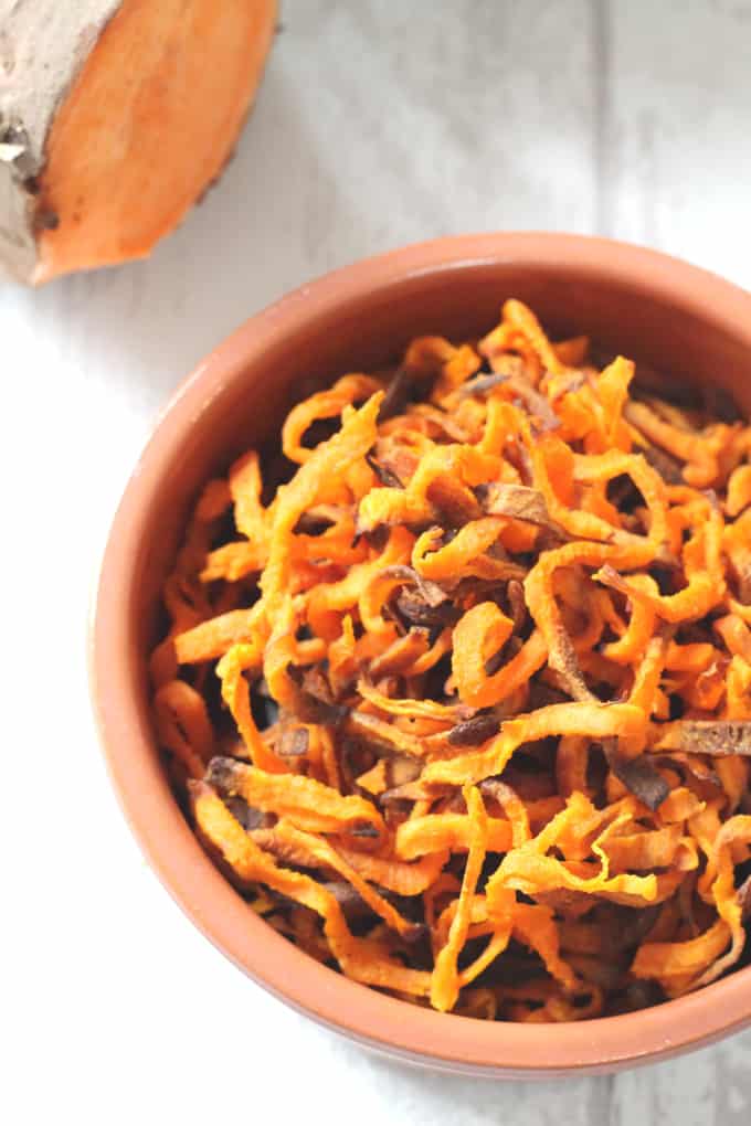 sweet potato fries cooked and served in a terracotta bowl