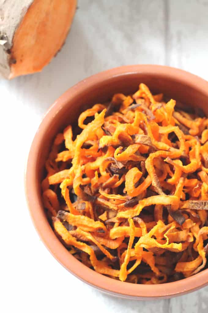 sweet potato fries cooked and served in a terracotta bowl 