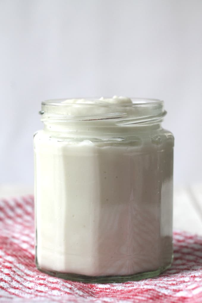 A deliciously creamy vegan sauce made using just cauliflower and coconut milk. Whole30 compliant!
creamy cauliflower sauce served in a clear glass jar.