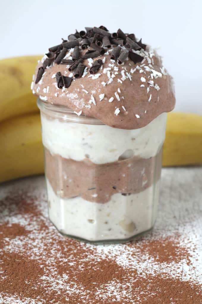 Chocolate & Vanilla Nana Ice Cream in a glass jar topped with chocolate flakes and and shredded coconut
