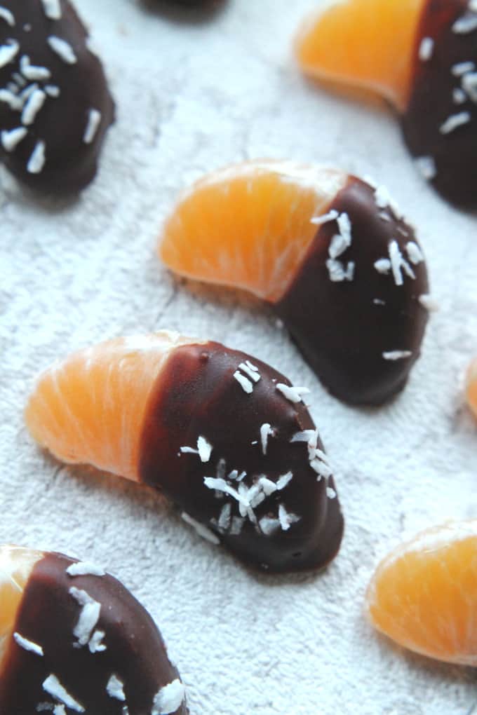 satsumas dipped in chocolate and dusted with desiccated coconut