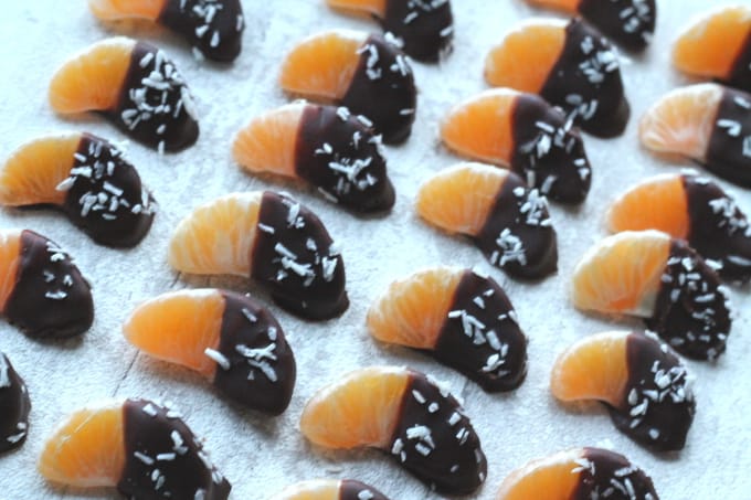 chocolate and coconut coated satsuma segments on a sultry tray