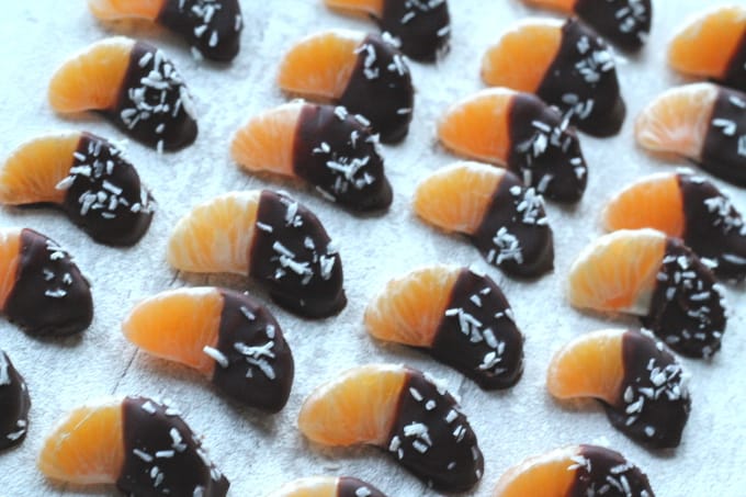 chocolate and coconut coated satsuma segments on a baking tray