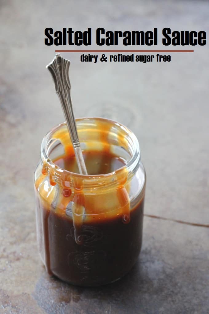 sugar free caramel sauce in a glass jar with a teaspoon in the jar