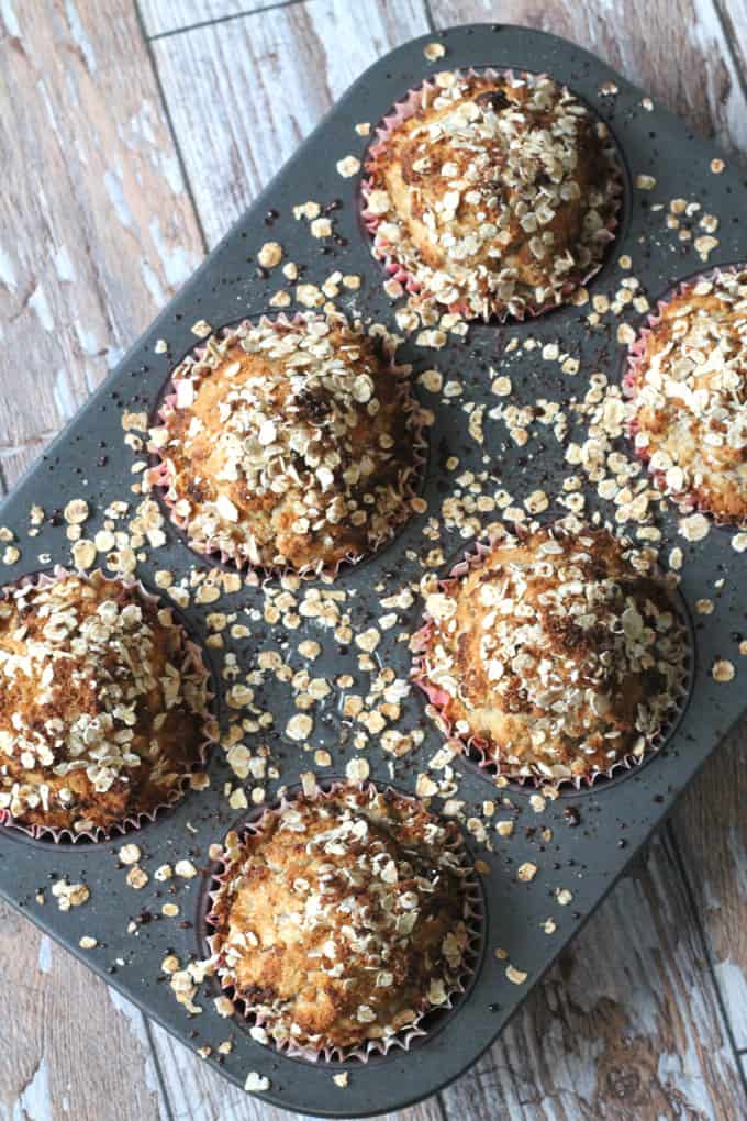 spiced pear and oat muffins in a gey muffin tray