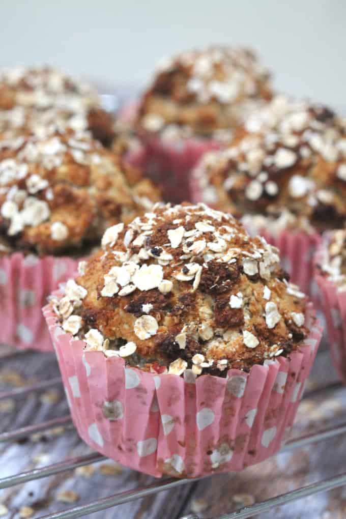 mixed spice pear muffins in pink and white polka dot cases cooling on a wire cooling rack