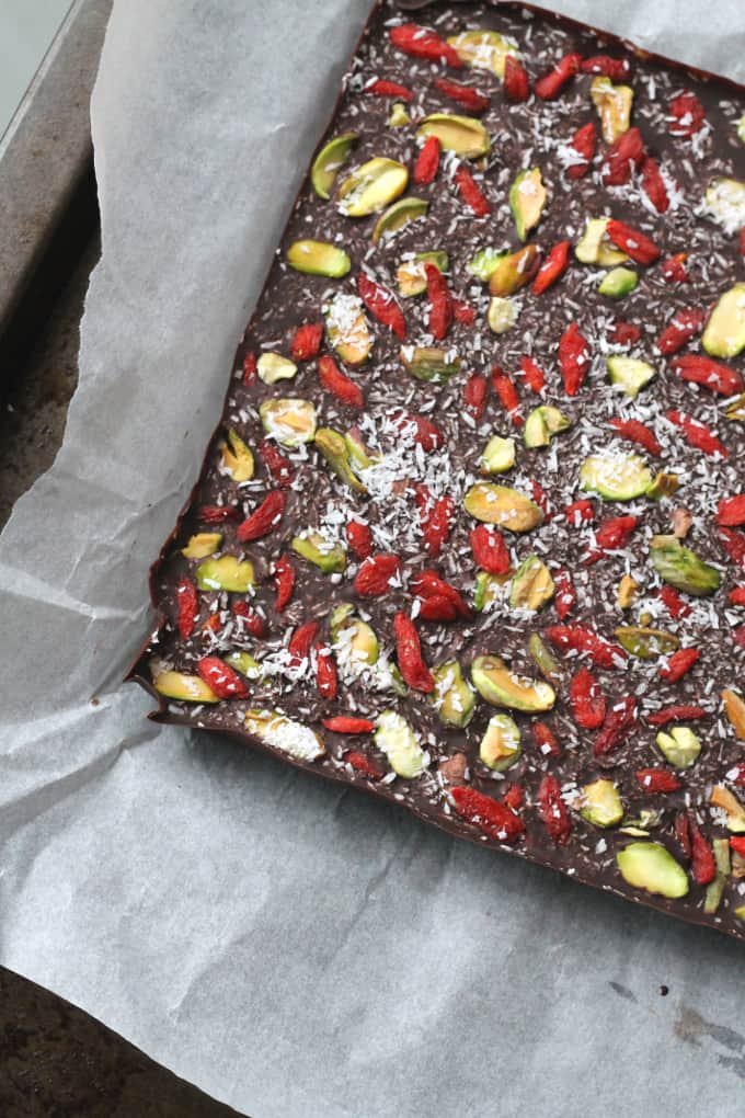 superfood chocolate bark slab on white parchment paper