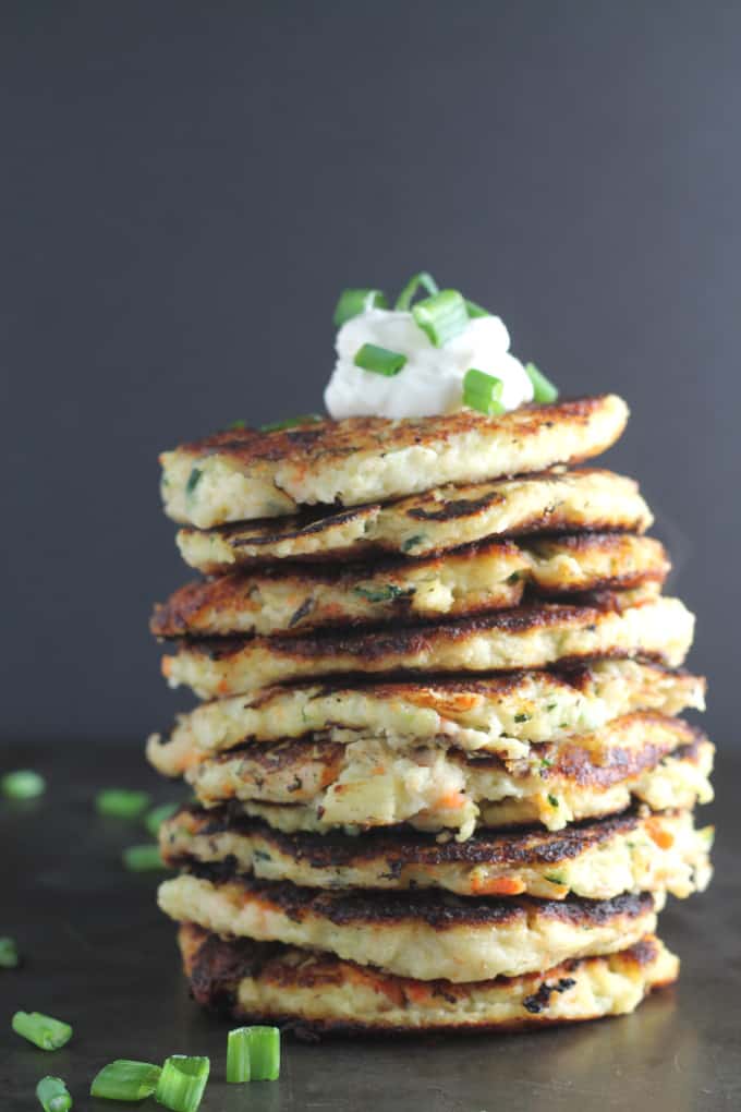 a stack of bubble and squeak fritters made with leftovers. Topped with creme fraiche and freshly chopped chives.