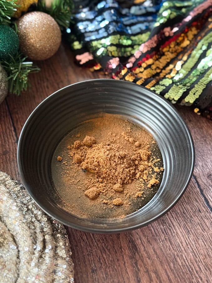 Brown sugar in a small bowl.
