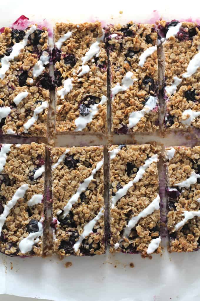 blueberry oat breakfast bar with a yogurt topping