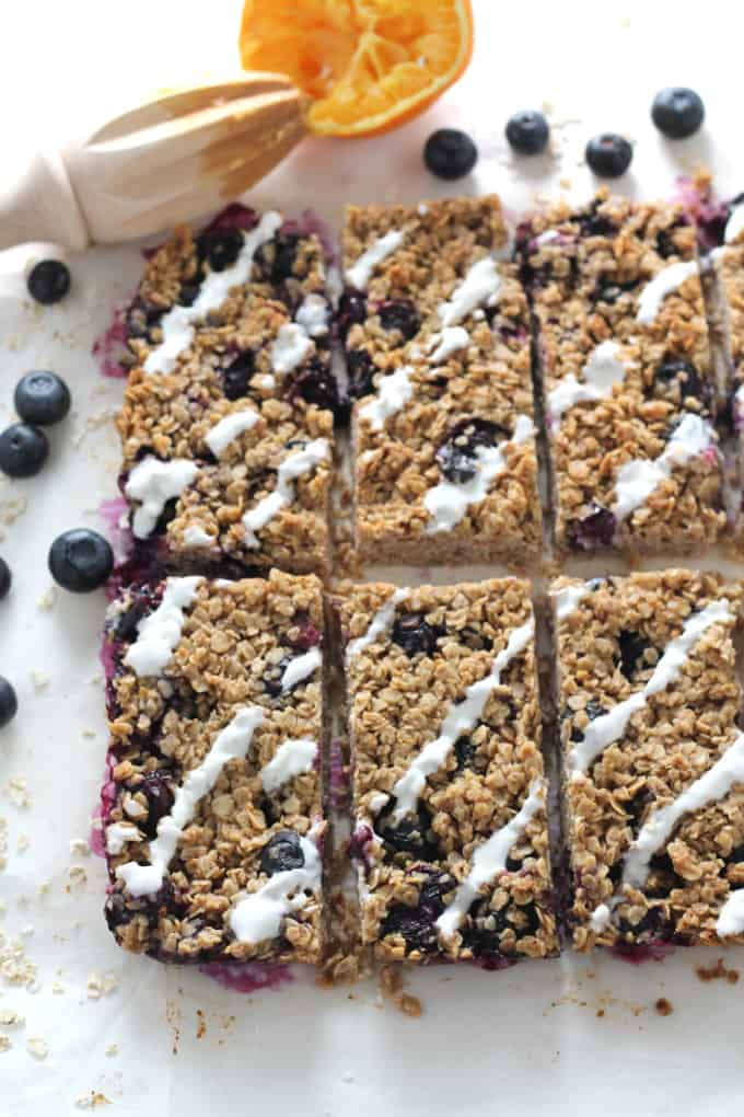 blueberry oat breakfast bar with orange and yogurt drizzle