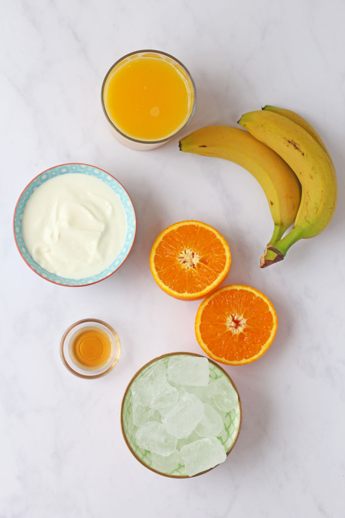 Flatlay of ingredients for a Sunshine Orange Smoothie