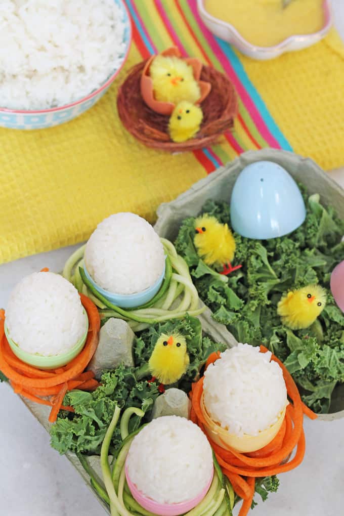 sticky rice easter eggs in an egg carton with mini chick decorations