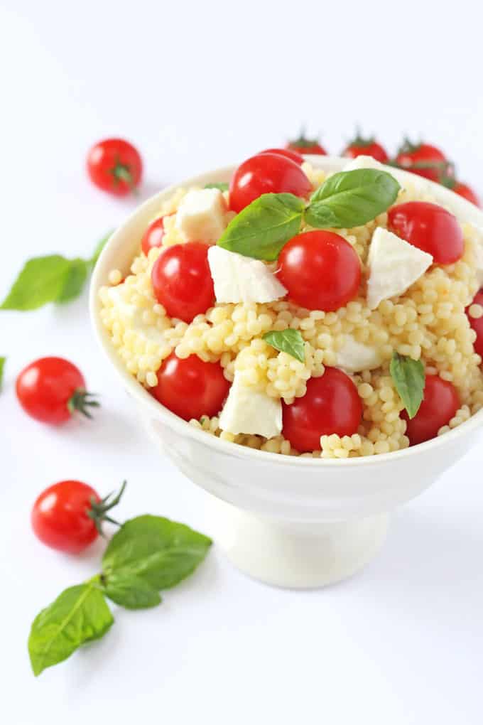 A fresh and colourful summer salad recipe made with giant cous cous, mozarella, cherry tomatoes and basil | My Fussy Eater blog