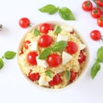 A fresh and colourful summer salad recipe made with giant cous cous, mozarella, cherry tomatoes and basil | My Fussy Eater blog