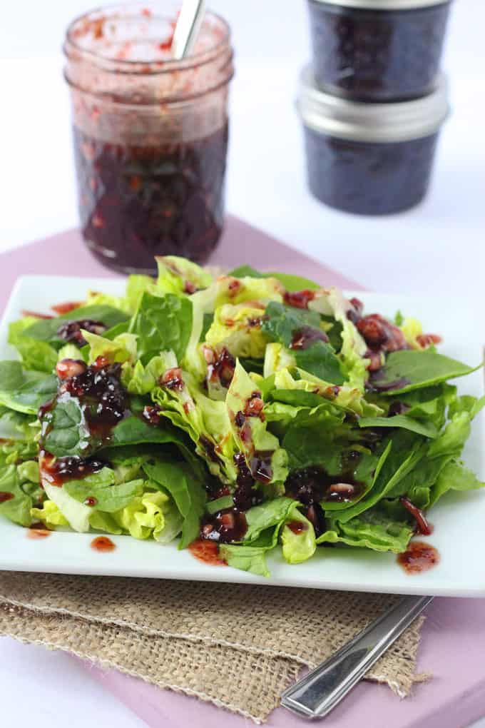 blue cheese salad dressing on salad leaves