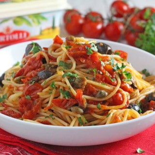 A super delicious and fresh pasta sauce made with Bertolli spread and packed with classic Italian flavours from tomatoes, garlic, capers, anchovies and olives. Really easy to make and sure to be a family hit!