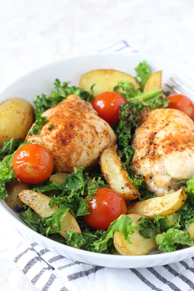 cajun chicken traybake served in a white bowl