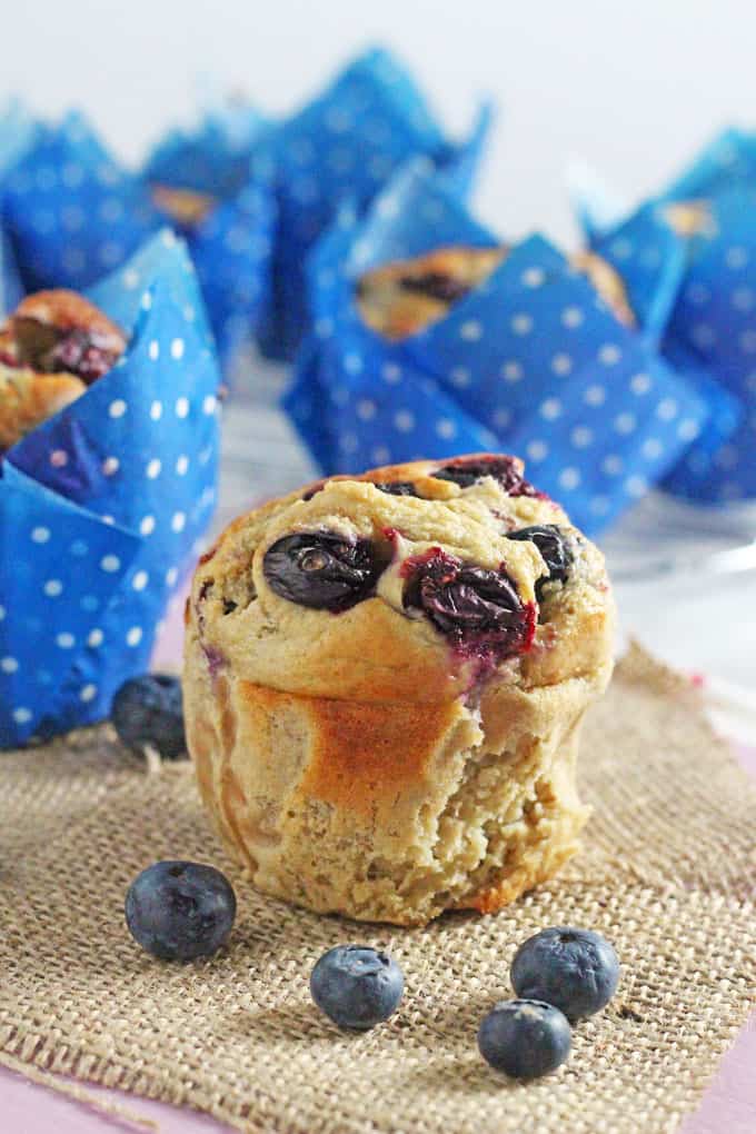 a close up of the muffin now removed from the casing with the other muffins in the background