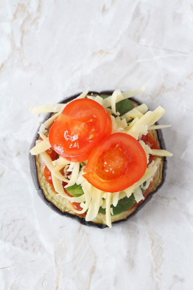 the aubergine slice now topped with 2 slices of cherry tomato