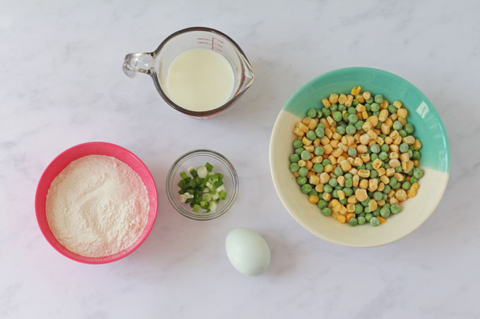Flatlay of ingredients for pea and sweetcorn fritters