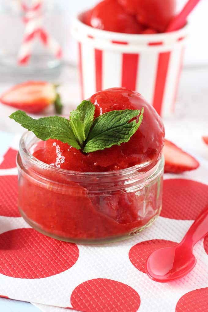 Strawberry Sorbet served in a coup dish topped with mint leaves