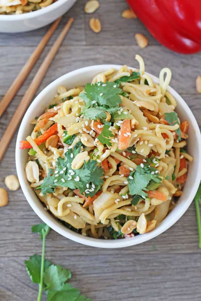 close up of the noodles served in a bowl with chopsticks