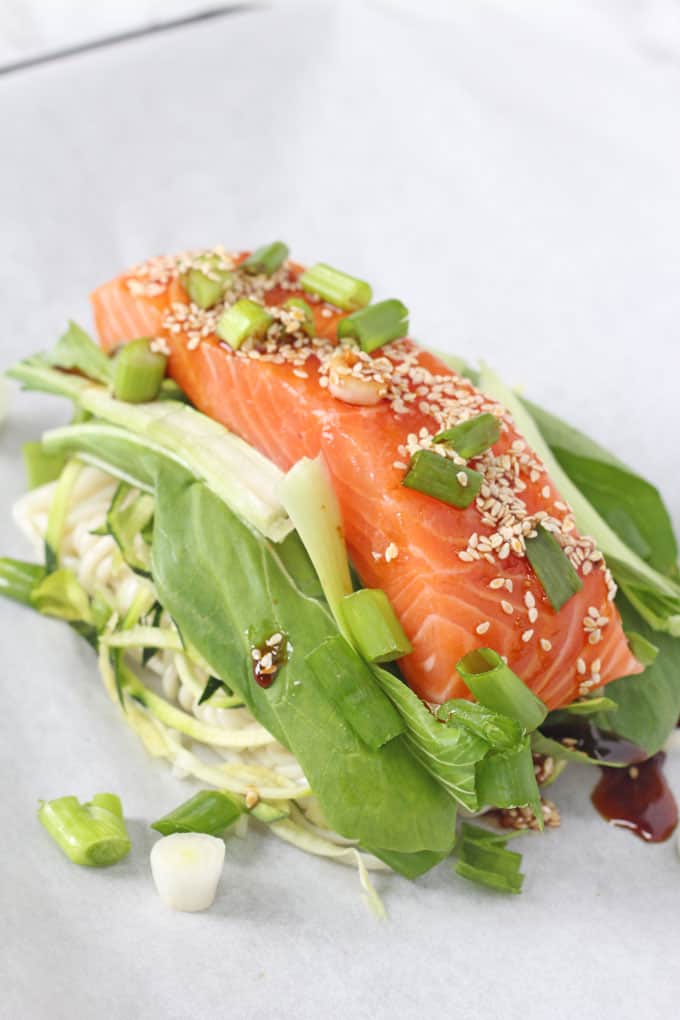 Sesame Salmon Noodle Parcels garnished with chopped spring onions.