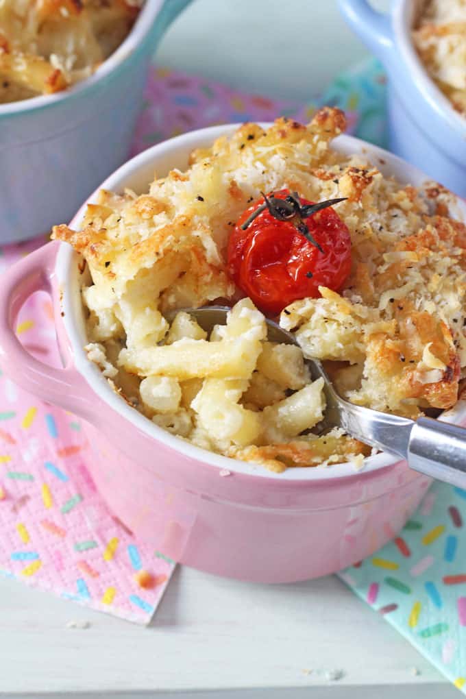 Cauliflower Mac & Cheese topped with a cherry tomato