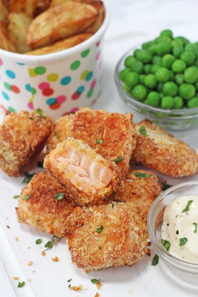 a salmon nugget cut in half to show the fish inside the golden crispy coating