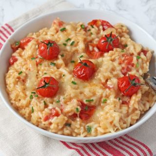 A delicious and kid-friendly Cheese & Tomato Risotto recipe, cooked in the oven to make it super easy!