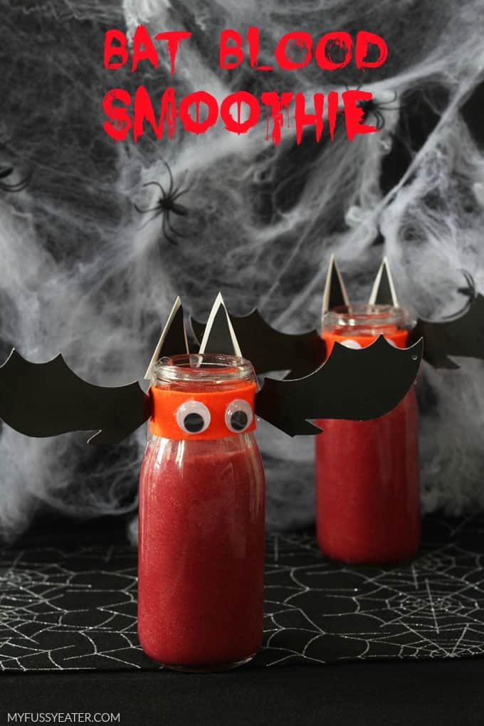 Two Bat Blood Smoothies in mini glass milk bottles decorated to look like bats.