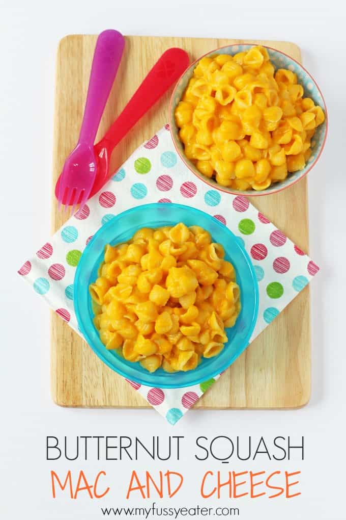 Butternut Squash & Cheese in two small children's bowls with a brightly coloured fork and spoon.