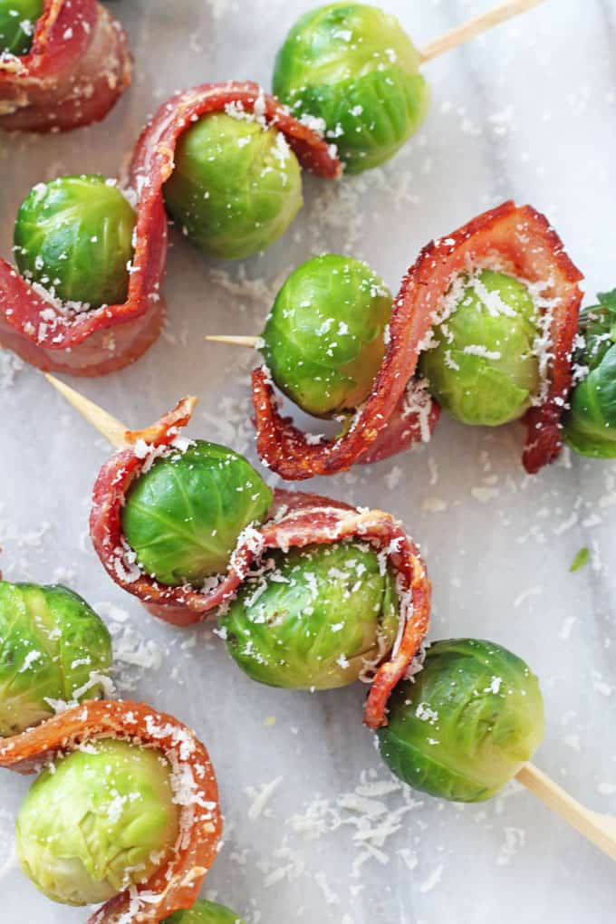 Bacon & Parmesan Brussels Sprout Skewers on a grey marble background
