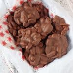 These super easy two ingredient Chocolate Peanut Clusters make the perfect last minute edible gift or snack idea this Christmas!