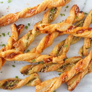 These Pesto Parmesan Pastry Straws make a super easy snack or party appetizer for the festive season!