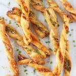 These Pesto Parmesan Pastry Straws make a super easy snack or party appetizer for the festive season!