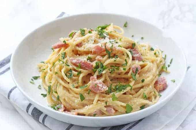 A delicious and super easy recipe for Spaghetti Carbonara, all cooked together in one pot. This tasty family meal takes just 15 minutes to prepare and cook, perfect for busy evenings when you don't have a lot of time to spend in the kitchen!
