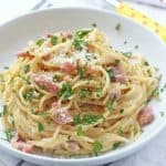 A delicious and super easy recipe for Spaghetti Carbonara, all cooked together in one pot. This tasty family meal takes just 15 minutes to prepare and cook, perfect for busy evenings when you don't have a lot of time to spend in the kitchen!