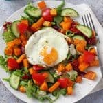 An easy and delicious Winter Butternut Squash Salad recipe, super quick to make and topped with a tasty fried egg!