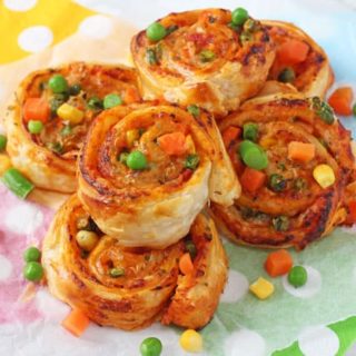 Super easy to make and packed with mixed vegetables, these Veggie Pizza Puff Pastry Roll Ups are sure to go down a treat with the whole family!