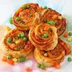 Super easy to make and packed with mixed vegetables, these Veggie Pizza Puff Pastry Roll Ups are sure to go down a treat with the whole family!