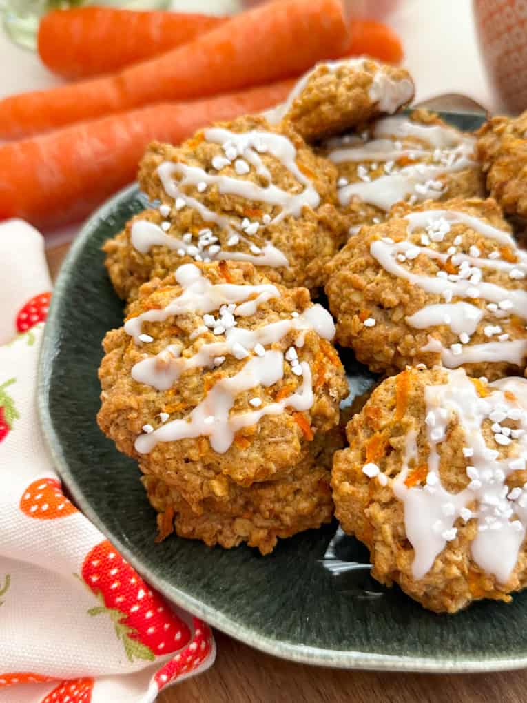 a close up overhead shot of the carrot cake cookies decorated with white icing 