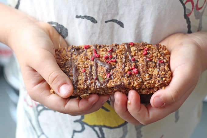 child holding a granola bar
